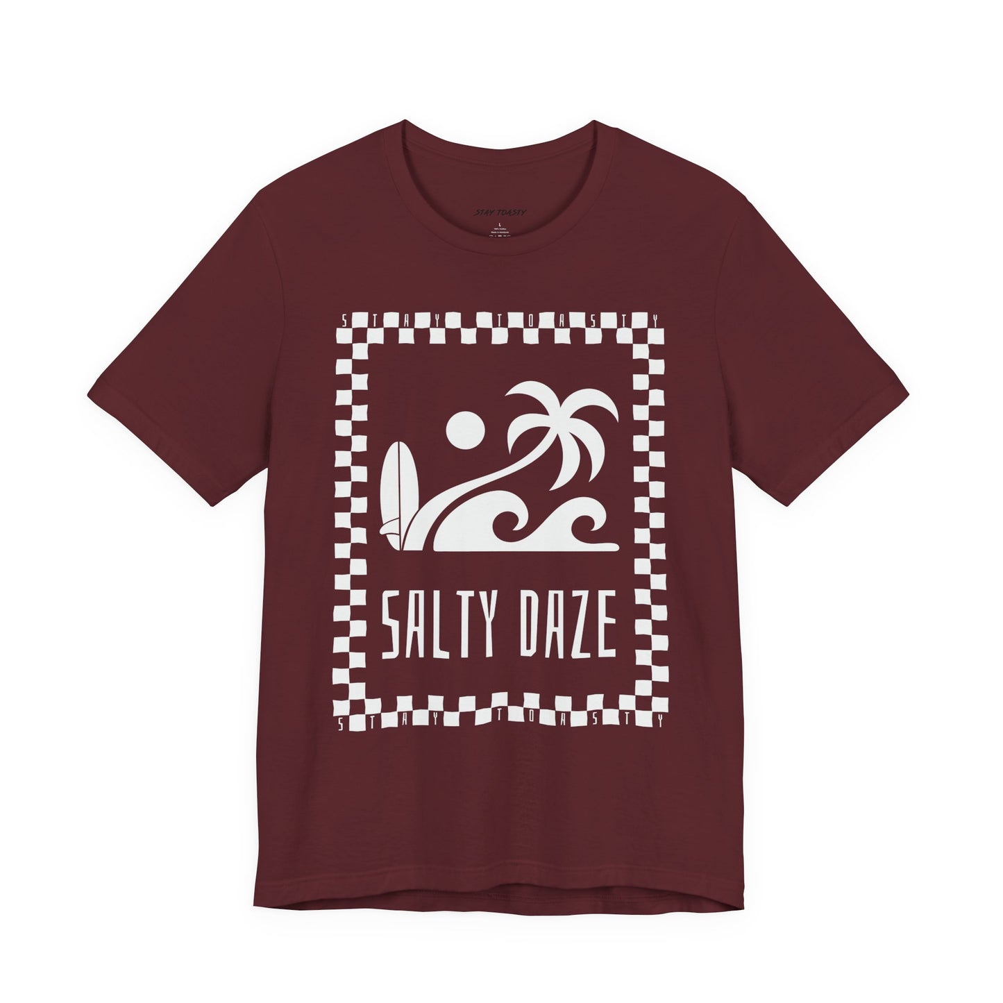 Front view of maroon T-shirt with ‘Salty Daze’ text and checker-outlined beach graphic design.