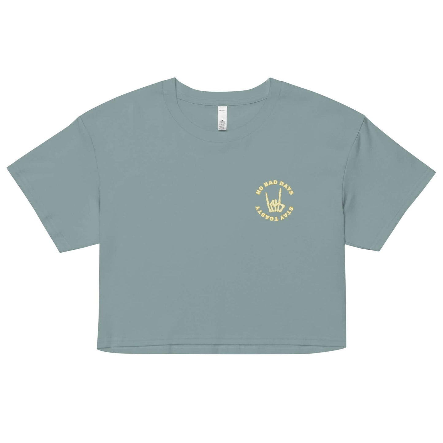 Womens graphic crop top. "No Bad Days" with a skeleton hand - front. Green.