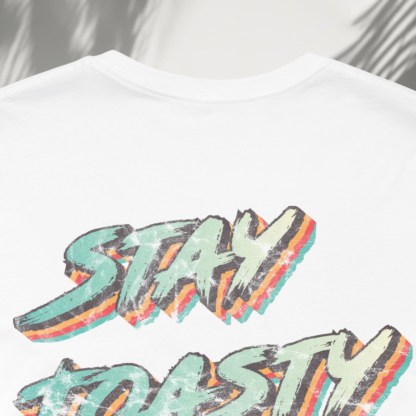 WhiteVintage Toast tee detail shot of colorful retro Stay Toasty back print typography