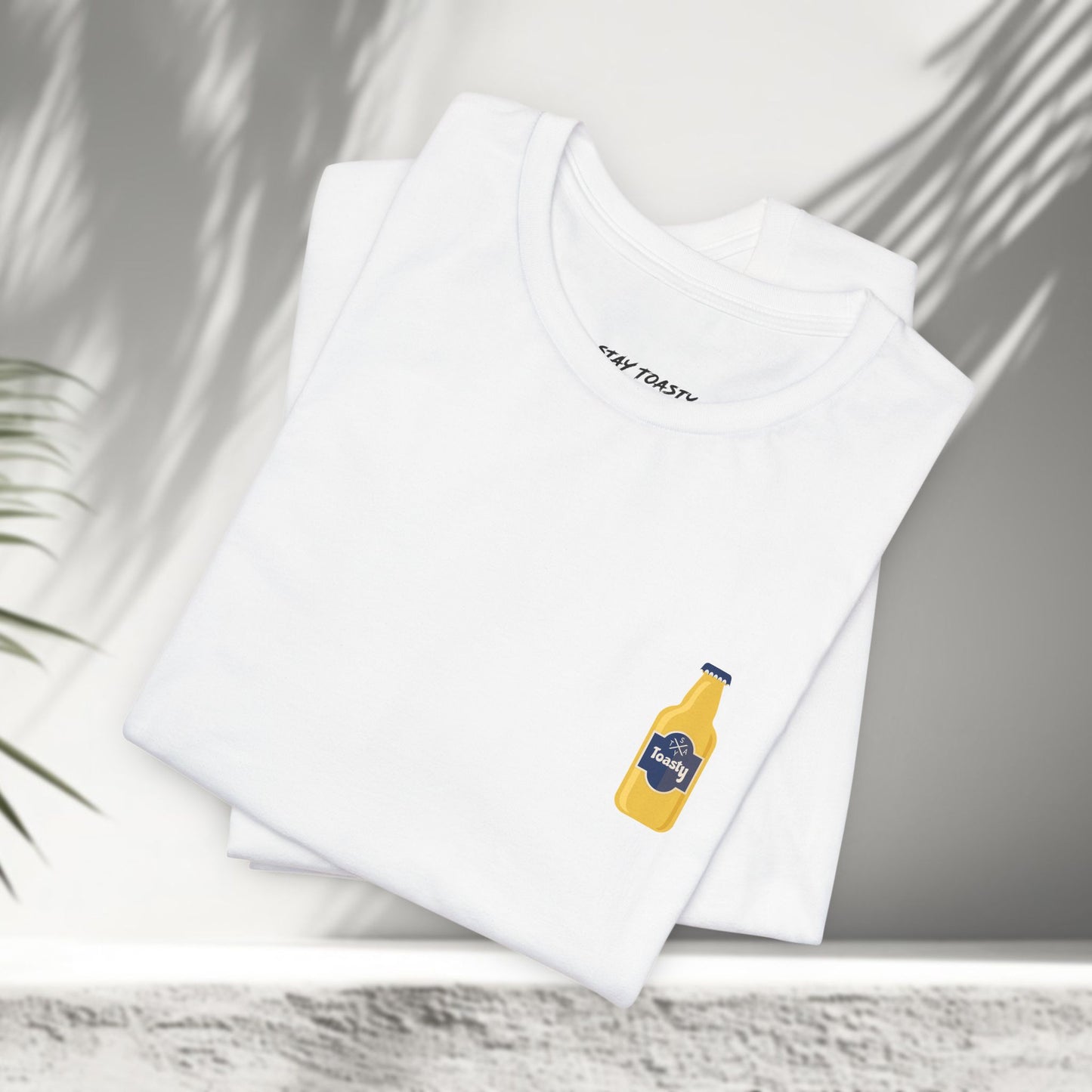 White Toasty Brew graphic tees folded showing small beer bottle chest print