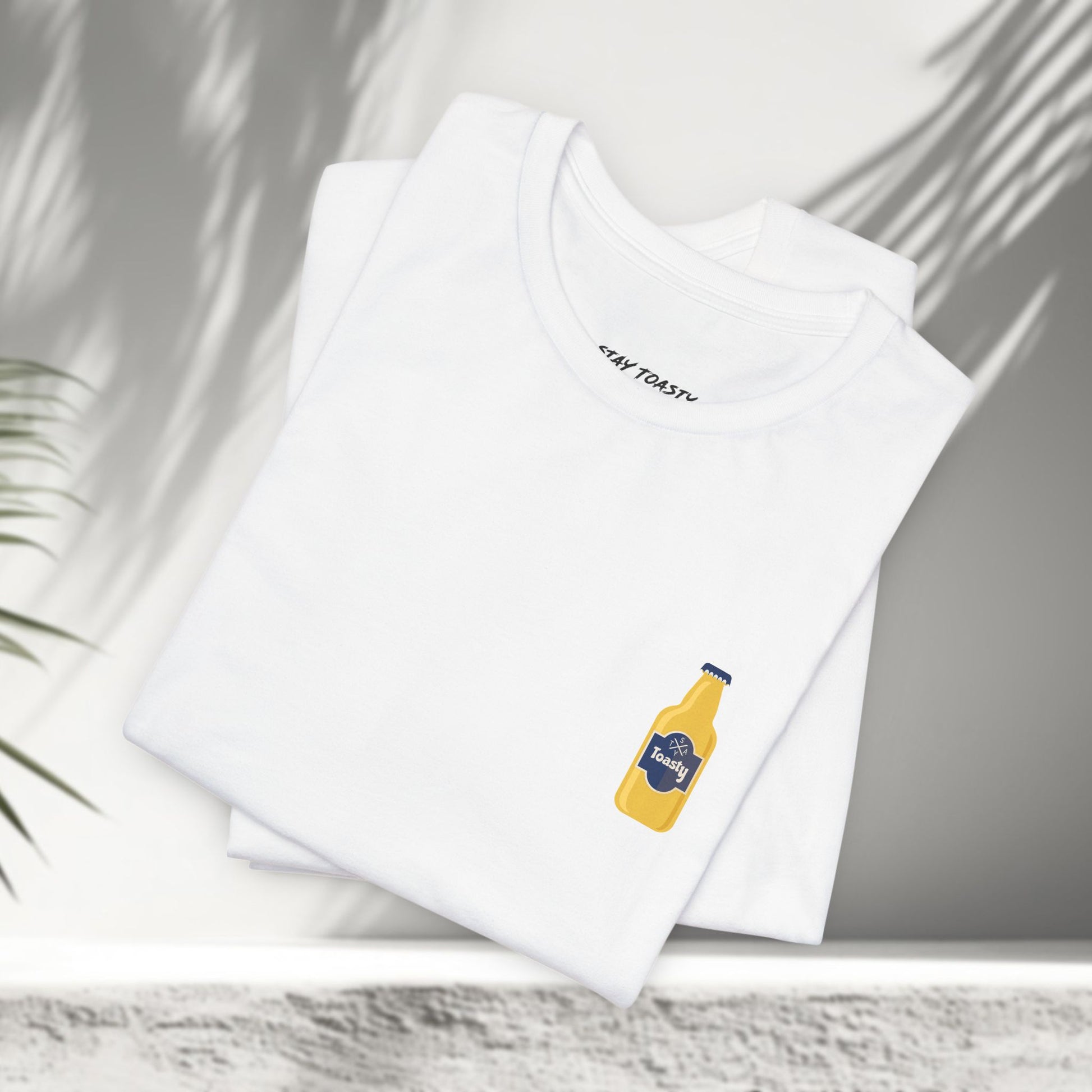 White Toasty Brew graphic tees folded showing small beer bottle chest print