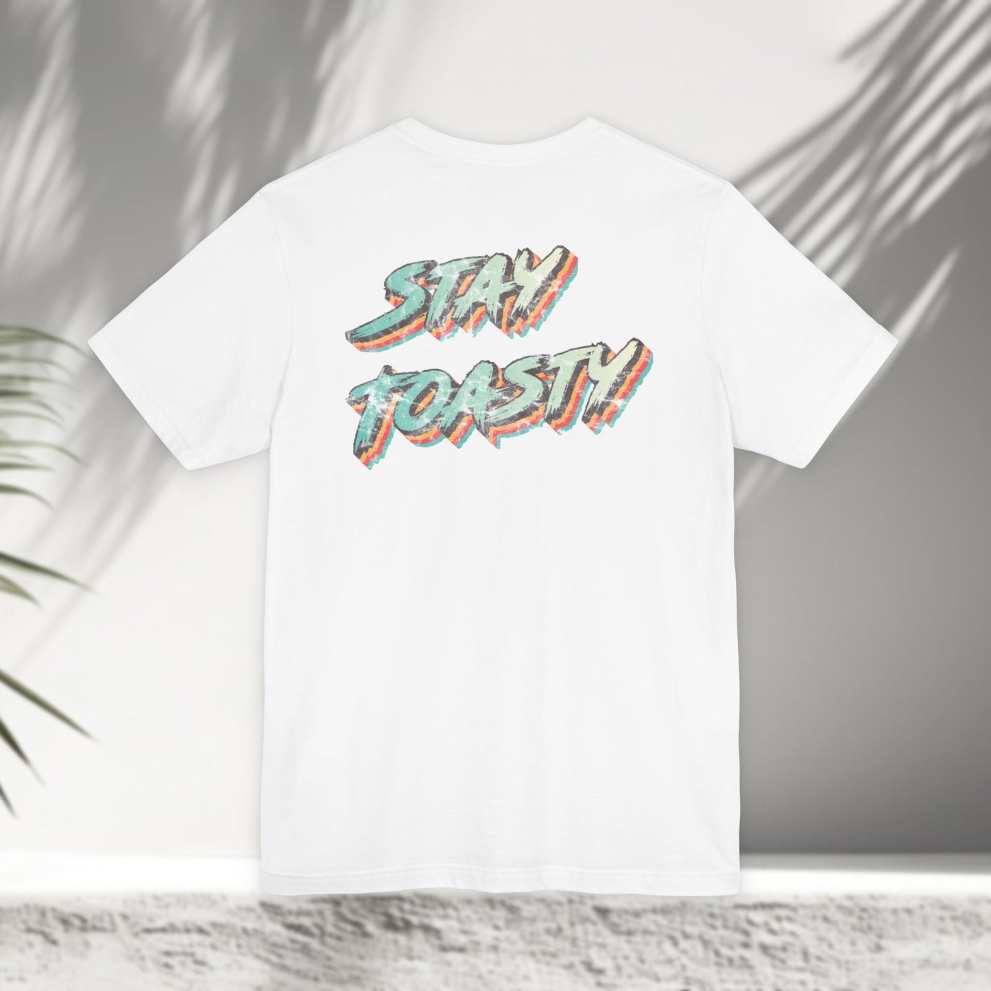 White Vintage Toast tee flat lay showing colorful retro Stay Toasty typography back print
