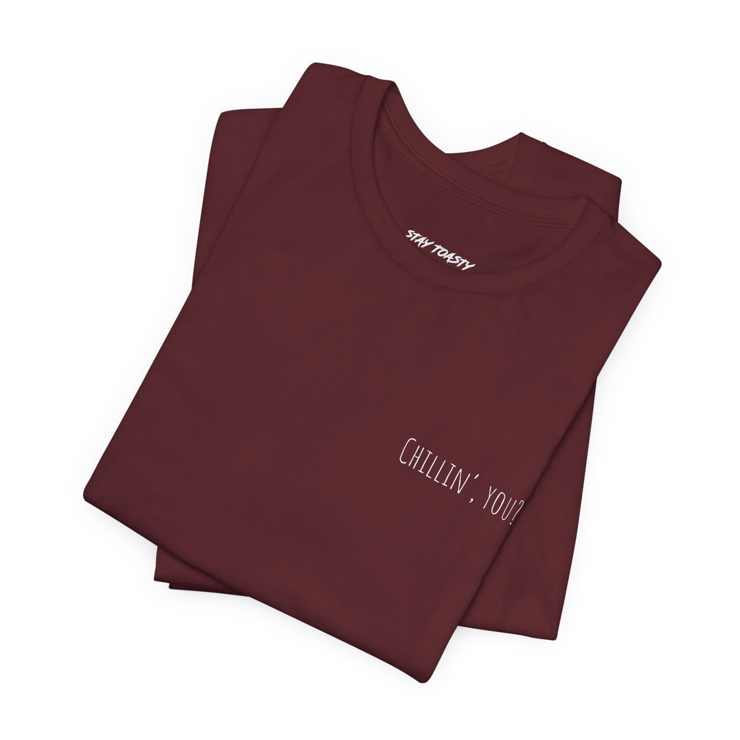 Folded maroon t-shirt with 'Chillin, you?' print on front chest.
