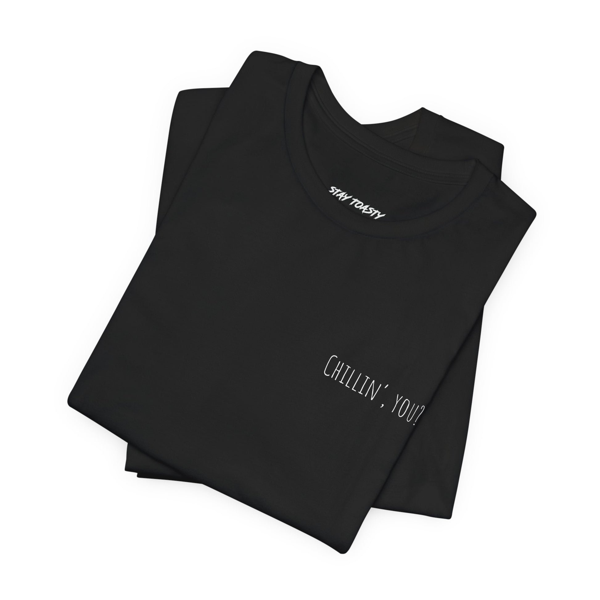 Folded black t-shirt with 'Chillin, you?' print on front chest.