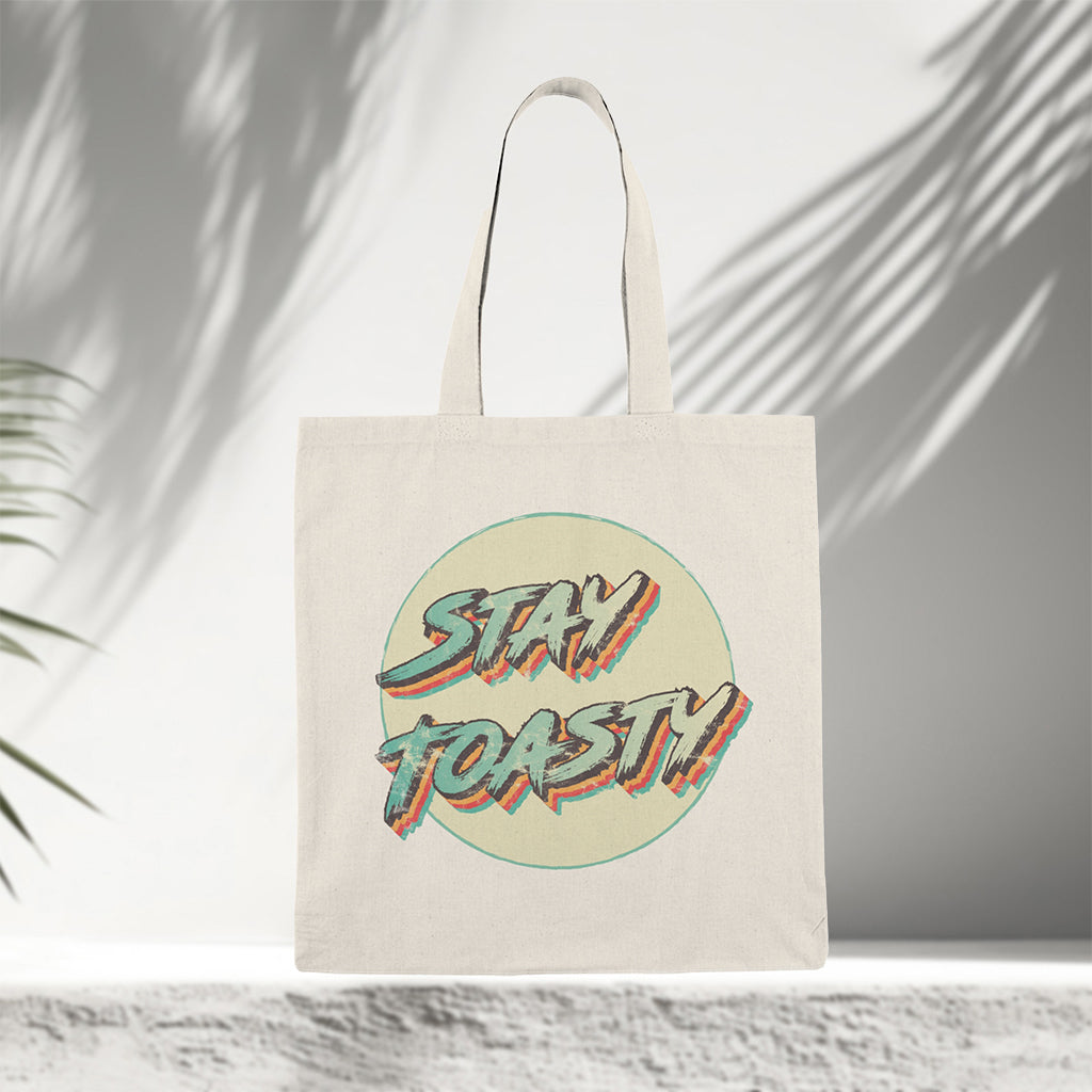 Tote bag with retro 'Stay Toasty' design on neutral canvas