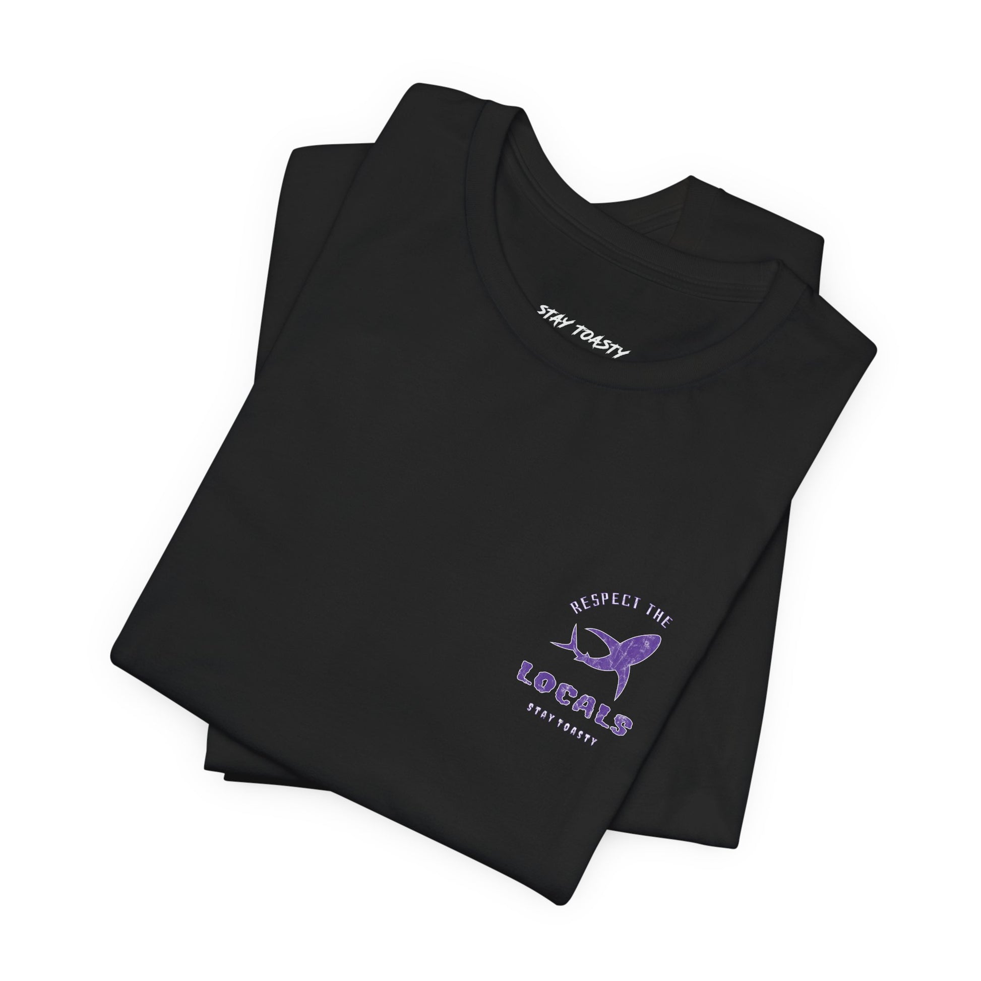 Front chest graphic on a black graphic tee of a purple marble textured shark featuring the text 'RESPECT THE LOCALS' and 'STAY TOASTY' . Folded tee.