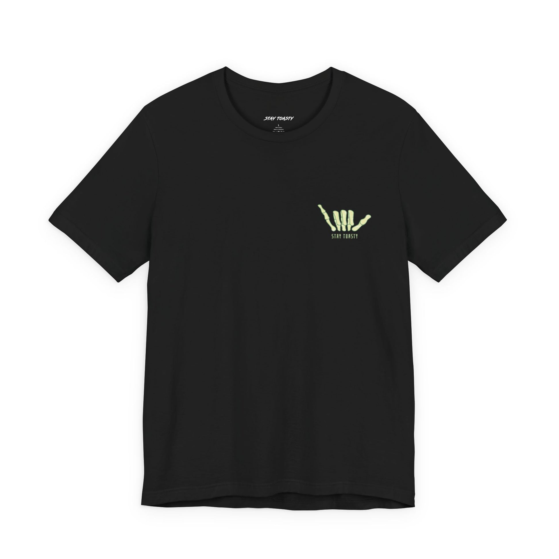 Black tee with front chest graphic of a skeleton hand shaka. Front view.