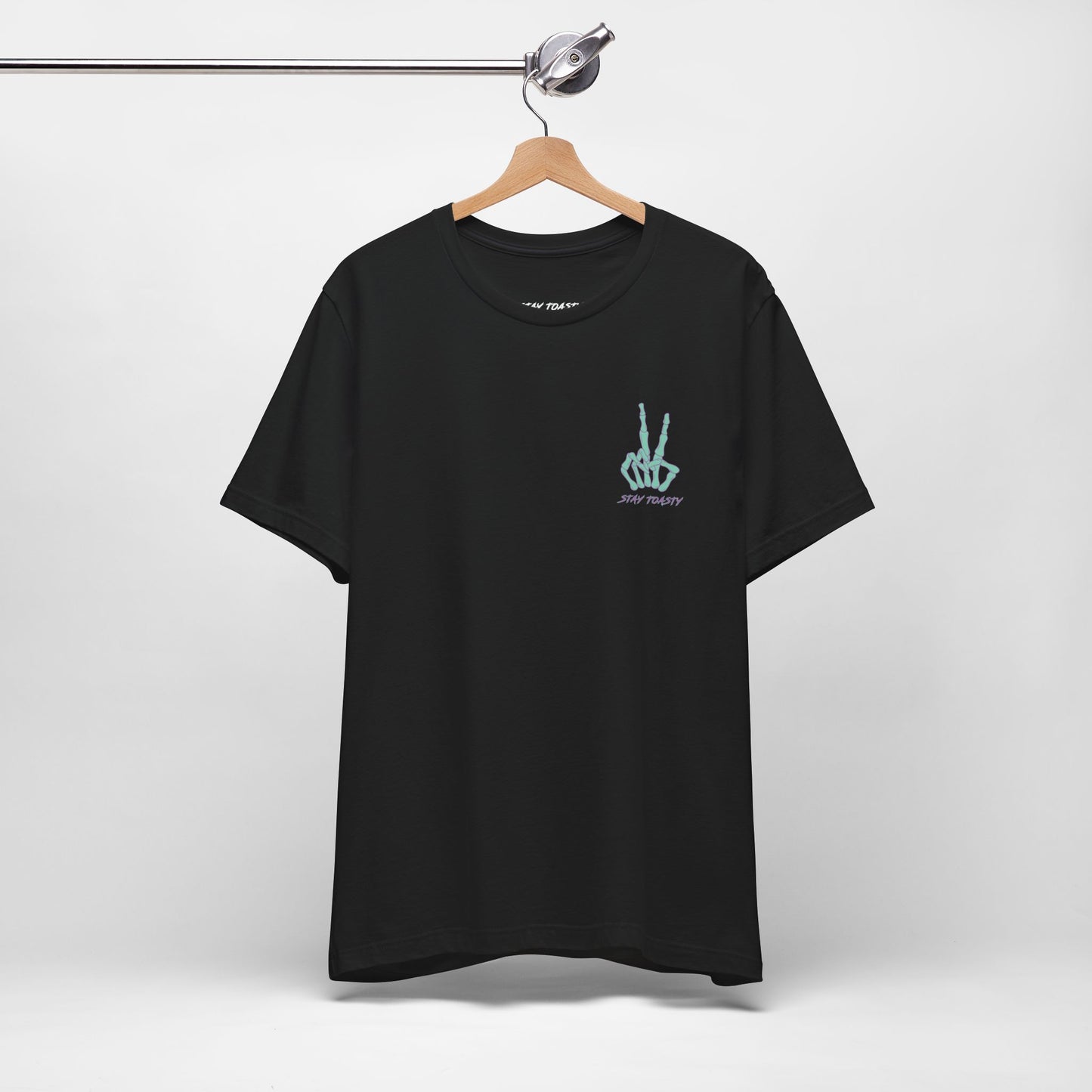 Black graphic tee with skeleton peace sign on front chest. Front view, hanging.