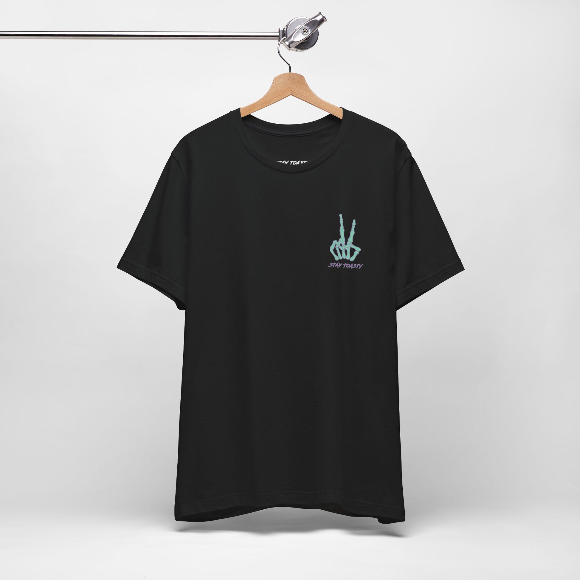 Black graphic tee with skeleton peace sign on front chest. Front view, hanging.