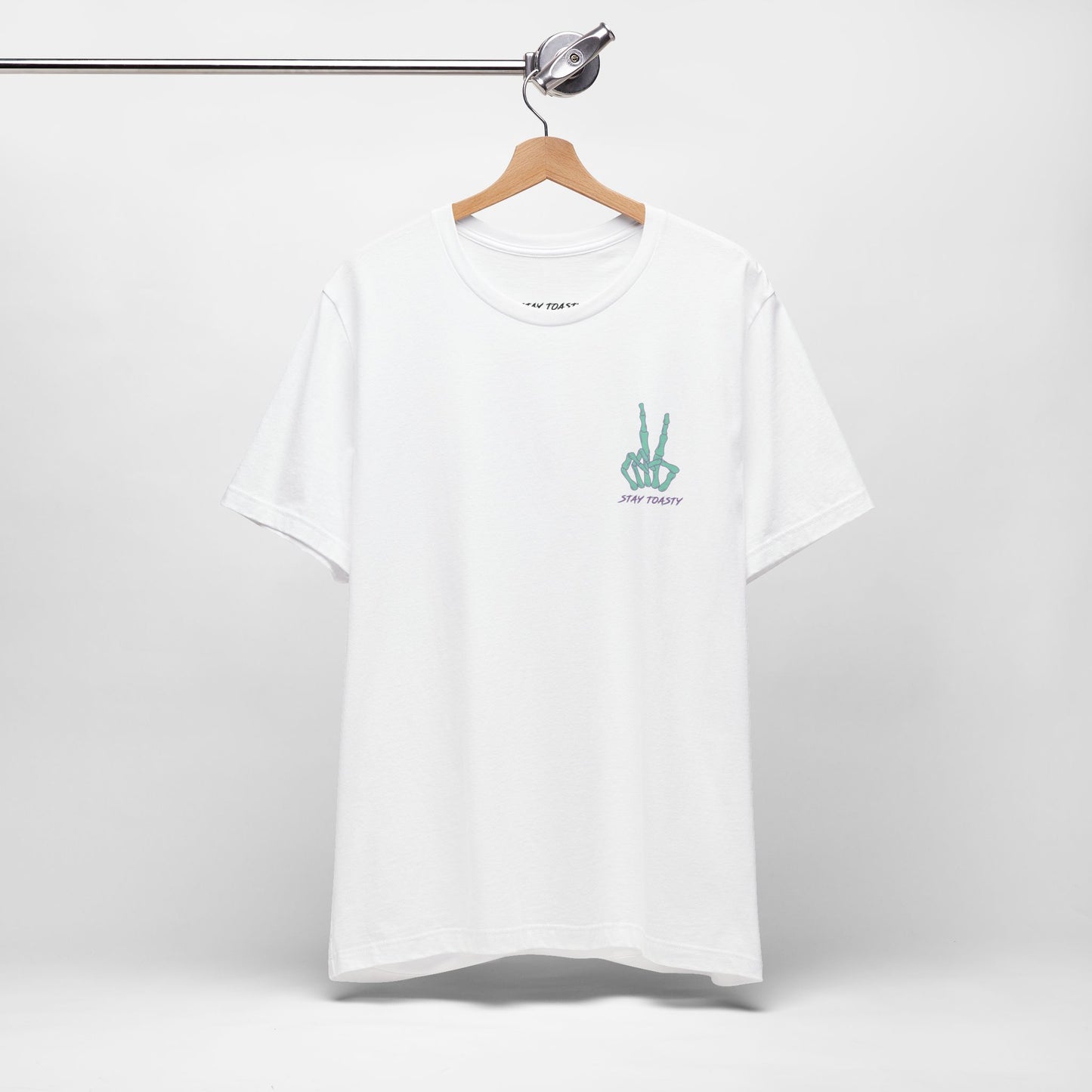 White graphic tee with skeleton peace sign on front chest. Front view, hanging.