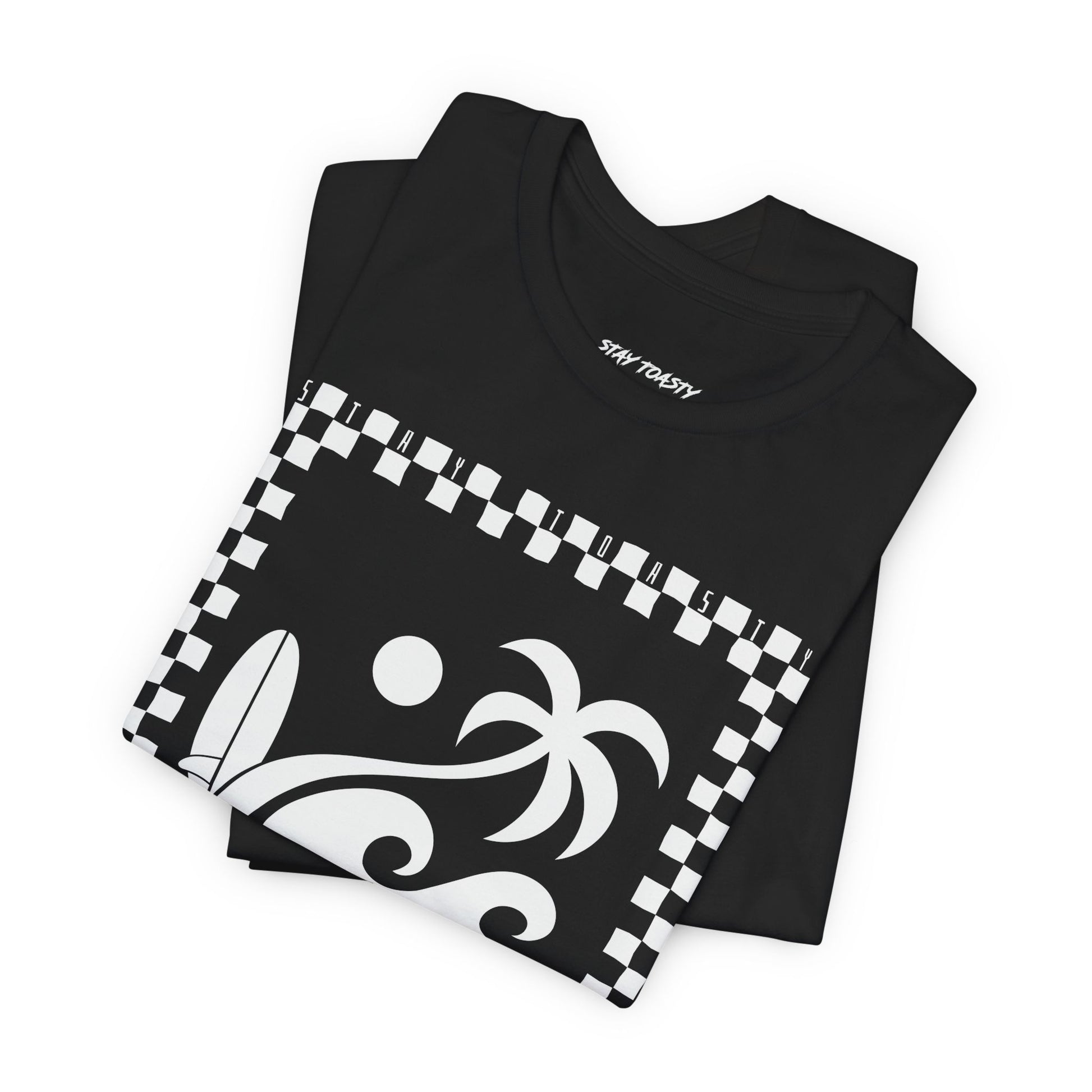 Folded black graphic tee with surf beach graphics with 'SALTY DAZE' text and 'Stay Toasty' inside of a checkered outline.