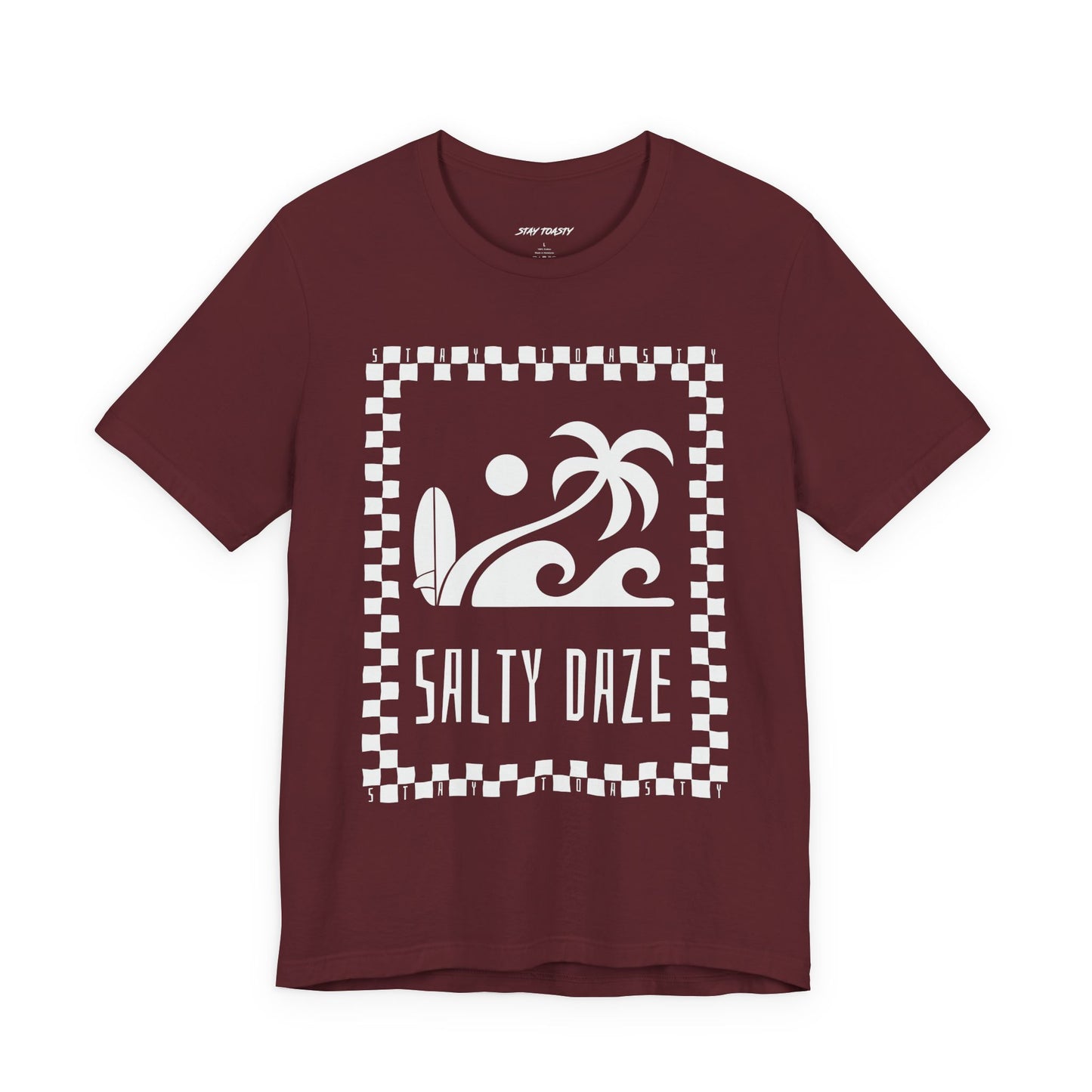 Maroon graphic tee with surf beach graphics with 'SALTY DAZE' text and 'Stay Toasty' inside of a checkered outline.