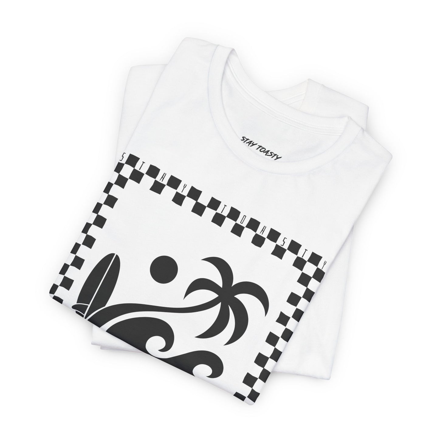 Folded white graphic tee with surf beach graphics with 'SALTY DAZE' text and 'Stay Toasty' inside of a checkered outline.
