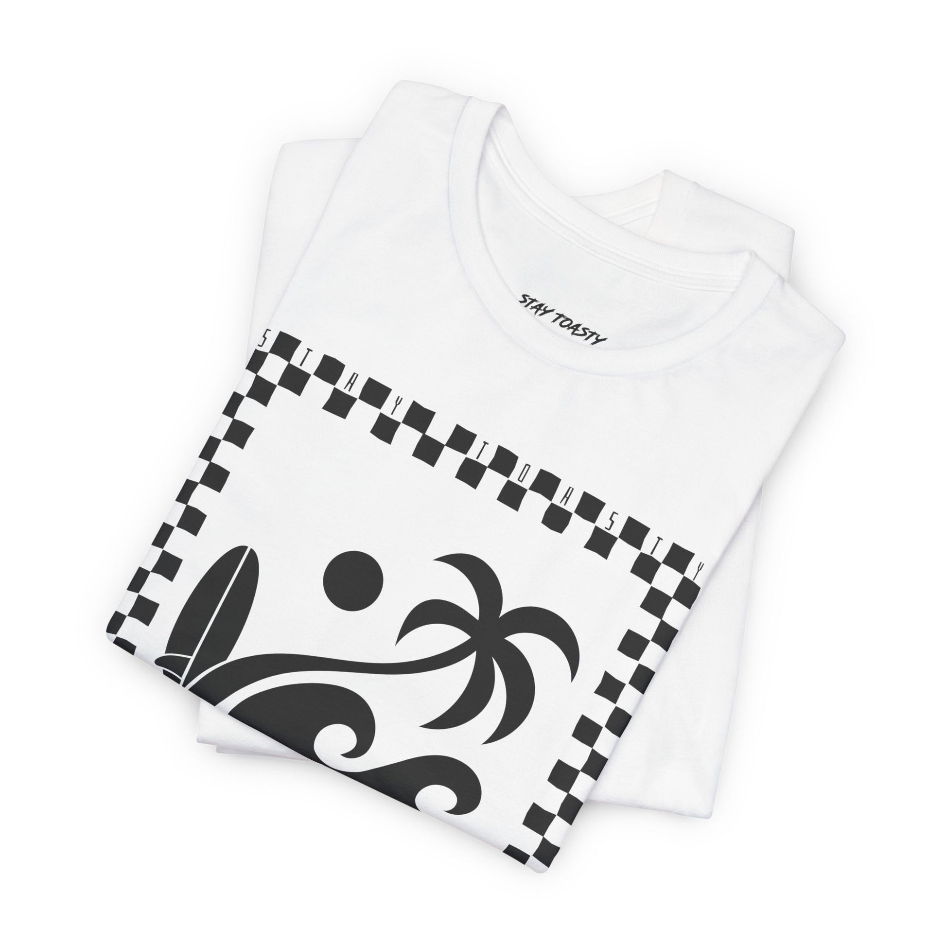 Folded white graphic tee with surf beach graphics with 'SALTY DAZE' text and 'Stay Toasty' inside of a checkered outline.