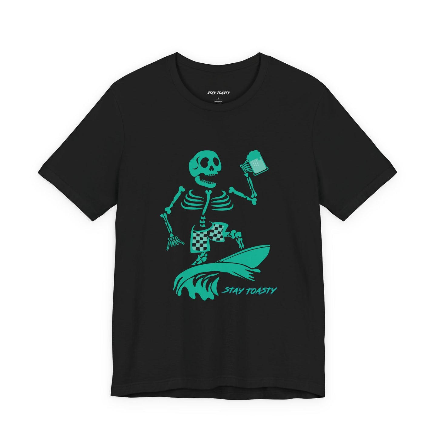 A black graphic tee featuring a green graphic of a skeleton surfing on a wave with a beer and the text 'STAY TOASTY' printed below.