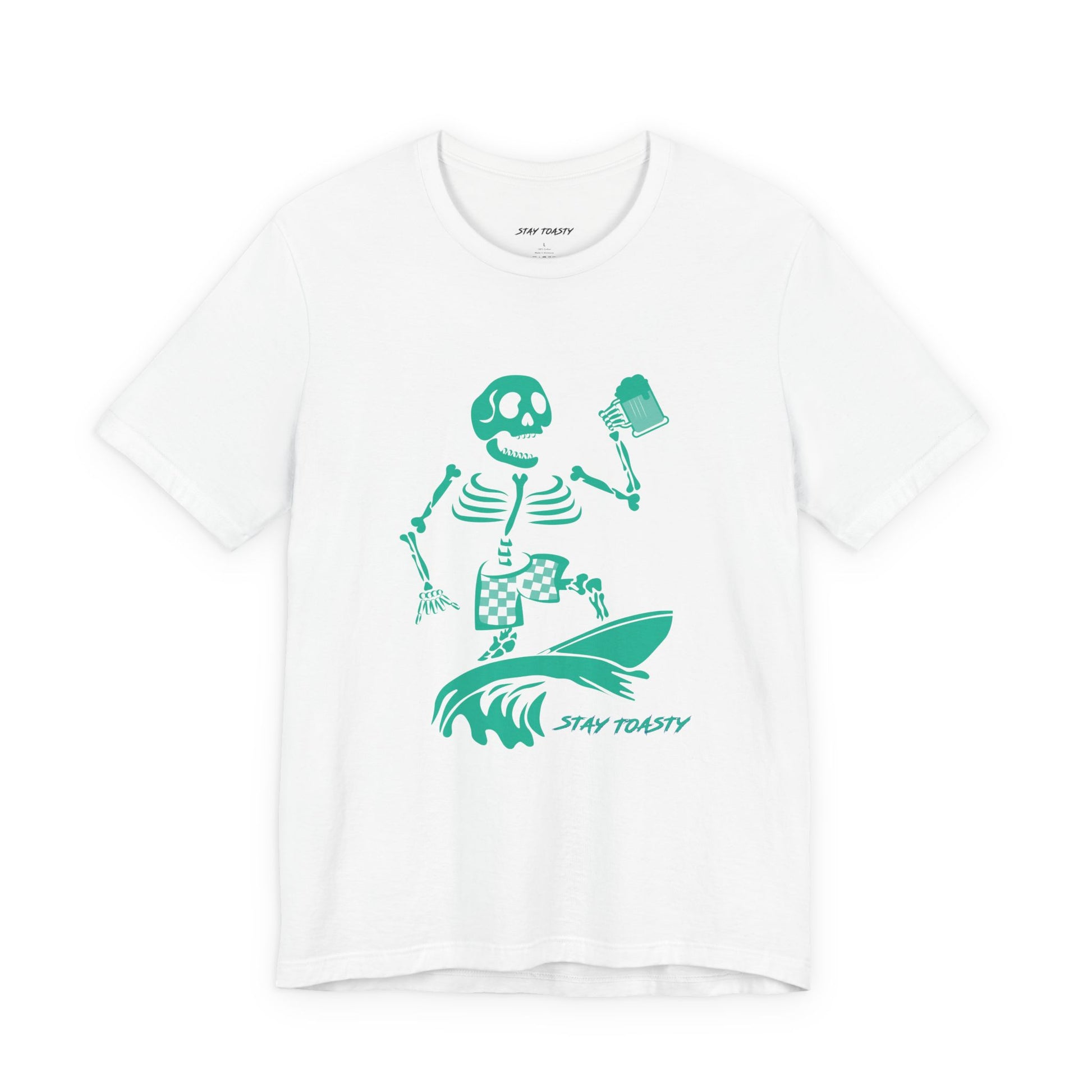 A white graphic tee featuring a green graphic of a skeleton surfing on a wave with a beer and the text 'STAY TOASTY' printed below.