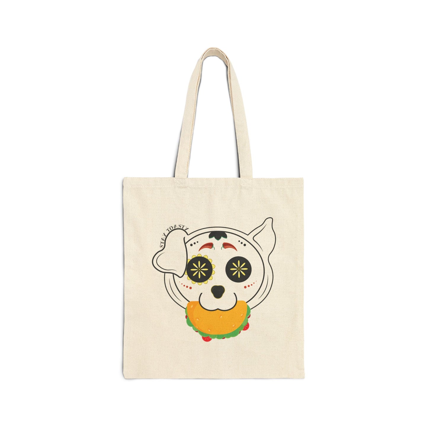 Beige tote bag with a sugar skull dog with a taco in his mouth