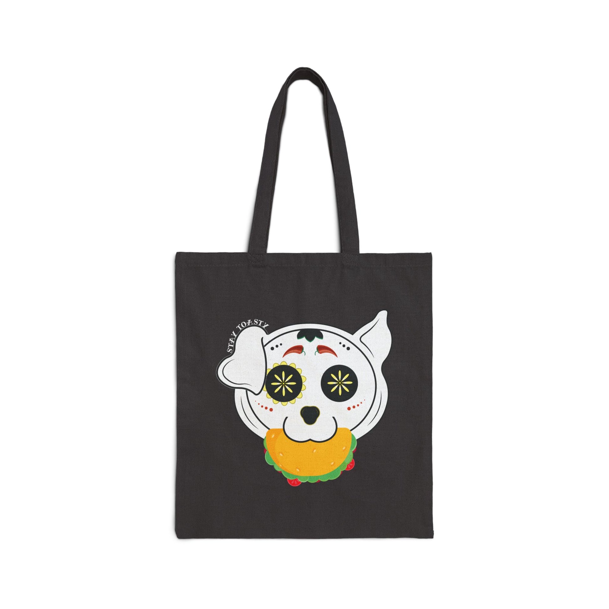 Black tote bag with a sugar skull dog with a taco in his mouth