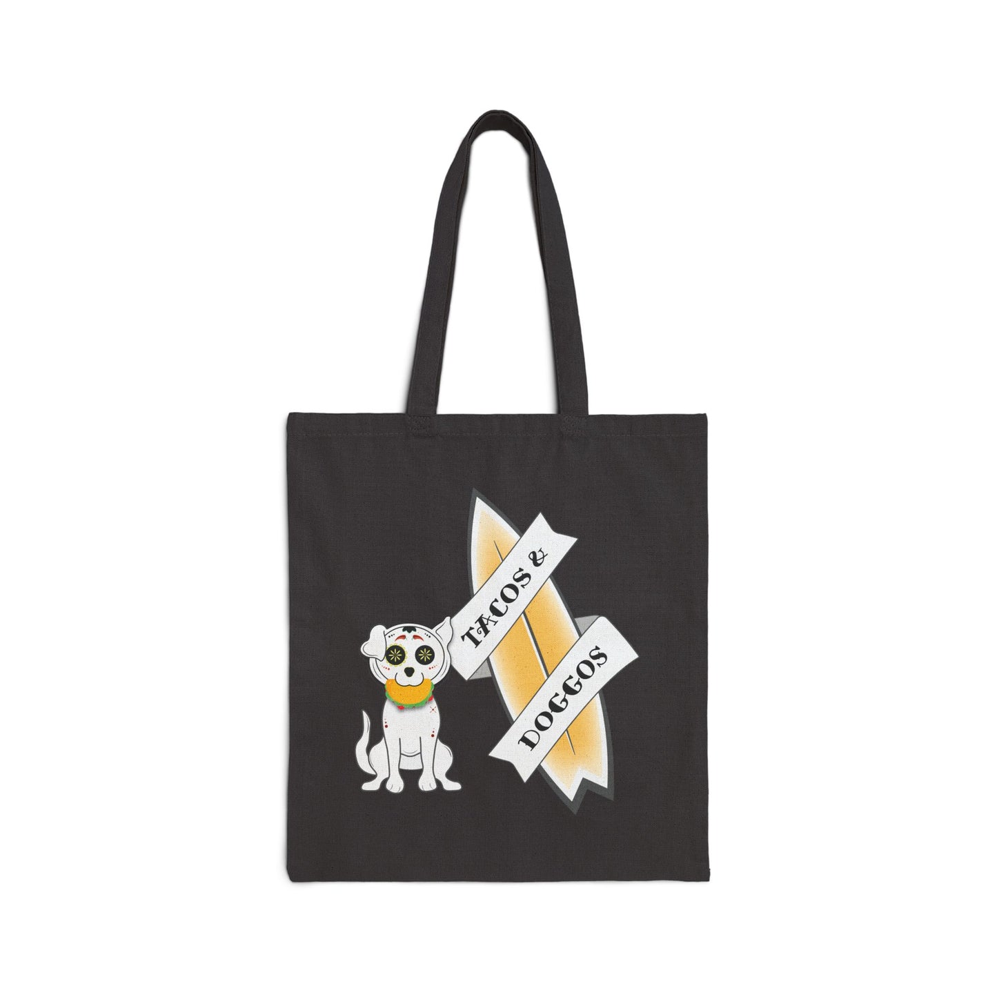 Black tote bag with a sugar skull dog with a taco in his mouth with text 'TACOS & DOGGOS'