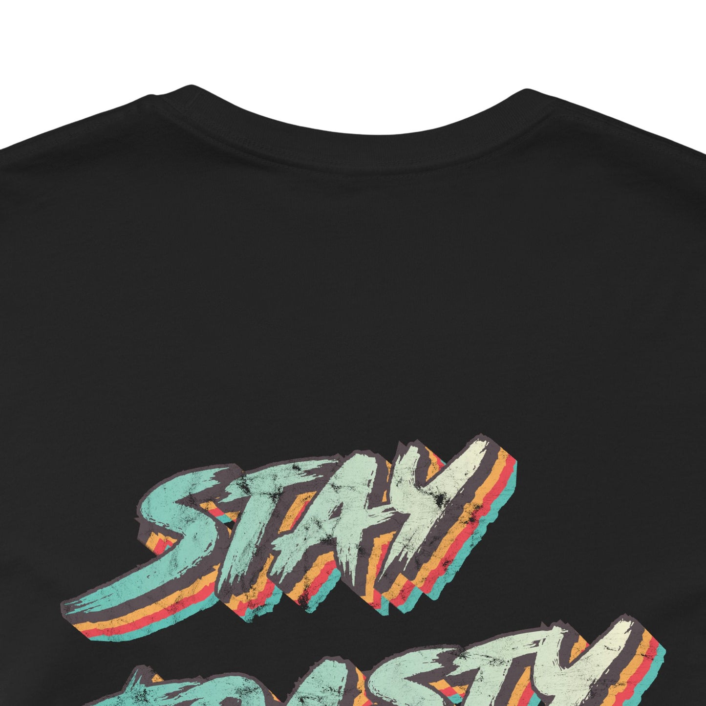Black graphic tee with vintage style text reading "Stay Toasty". Back close-up view.