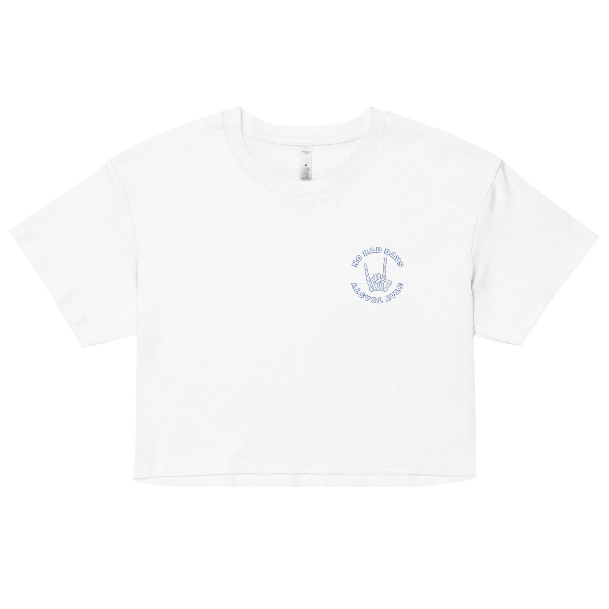 Womens graphic crop top. "No Bad Days" with a skeleton hand - front. White.
